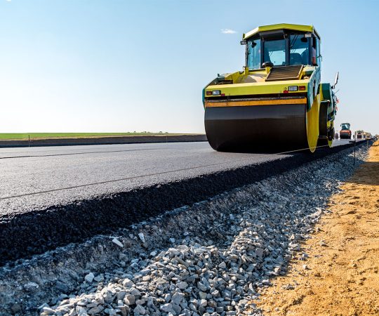 Road rollers building the new asphalt road